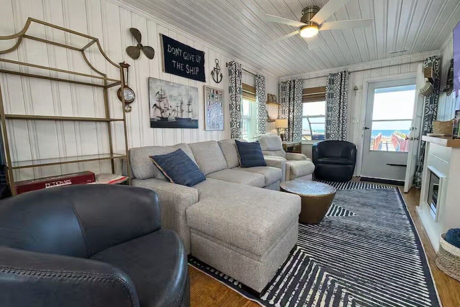 Smart TV, fireplace, books, computer monitors
