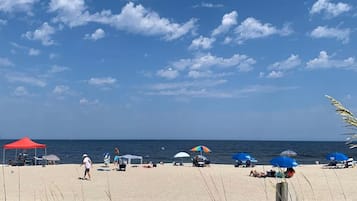 On the beach, sun loungers, beach towels