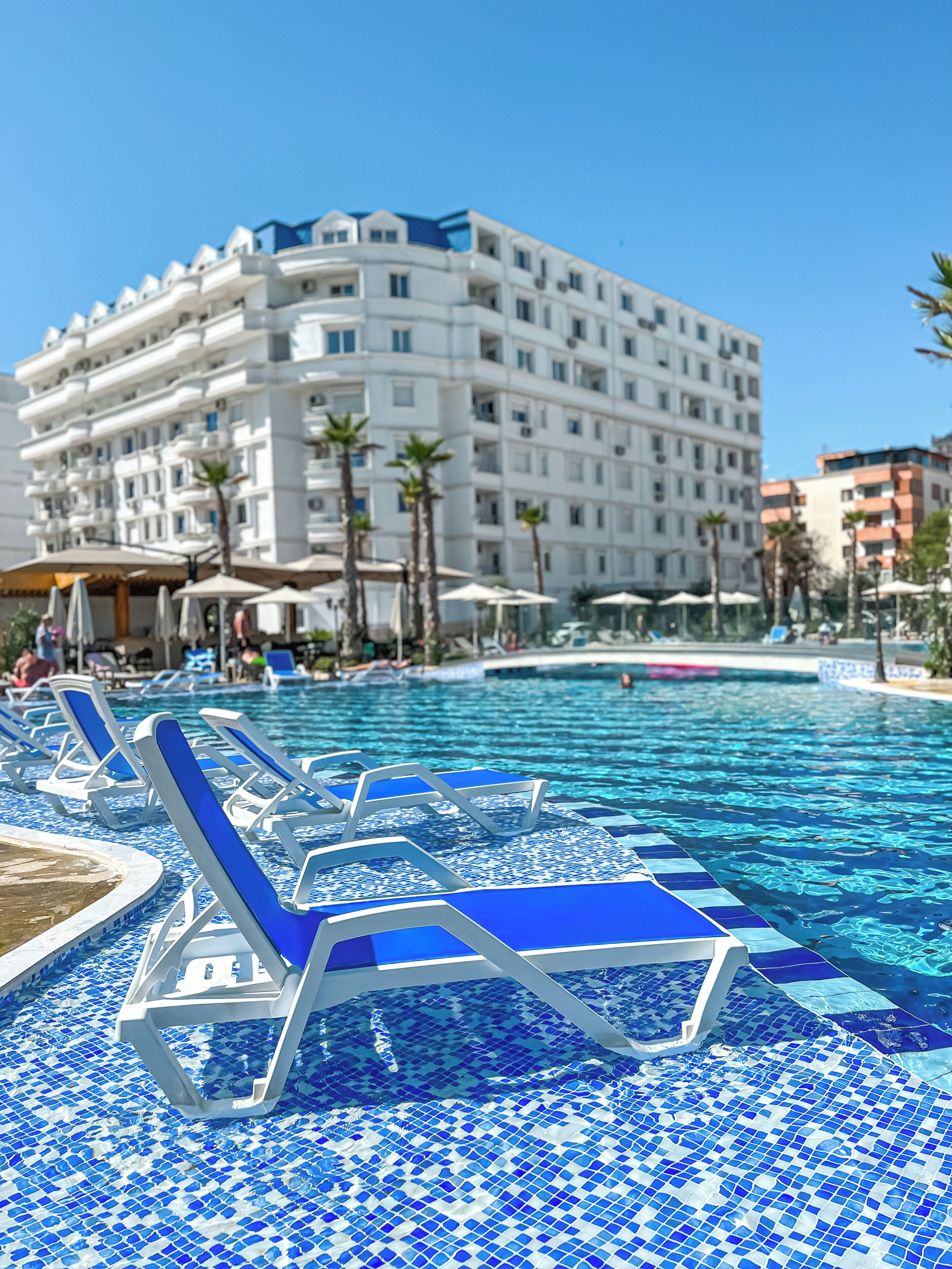 Seasonal outdoor pool, open 9:00 AM to 6:00 PM, pool umbrellas