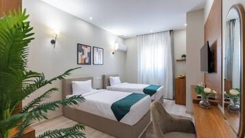 Superior Twin Room | Minibar, in-room safe, desk, blackout drapes