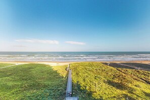 A coastal walkway leading to a beach with a clear view of the ocean. - Sweeping View, Luxe Perks: Suntide III - Unit 708 (South Padre Island)