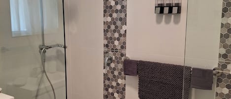 Shower, hair dryer, towels, soap