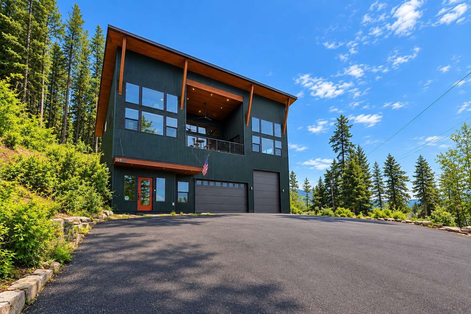 The home exterior with a two-car garage and upper deck