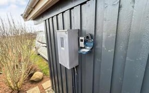 A utility box mounted on a building's exterior wall. - 4 Star Holiday Home in Hejls (Hejls)
