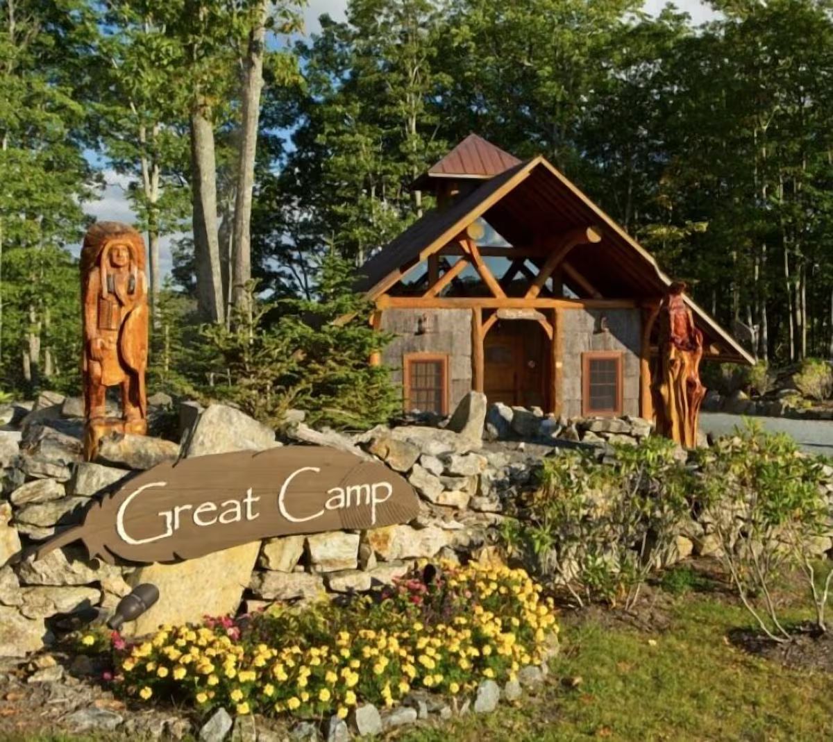 A rustic cabin labeled "Great Camp" with a stone foundation, wooden beams, and a sloped roof.