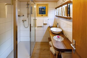 Shower, hair dryer, towels, toilet paper