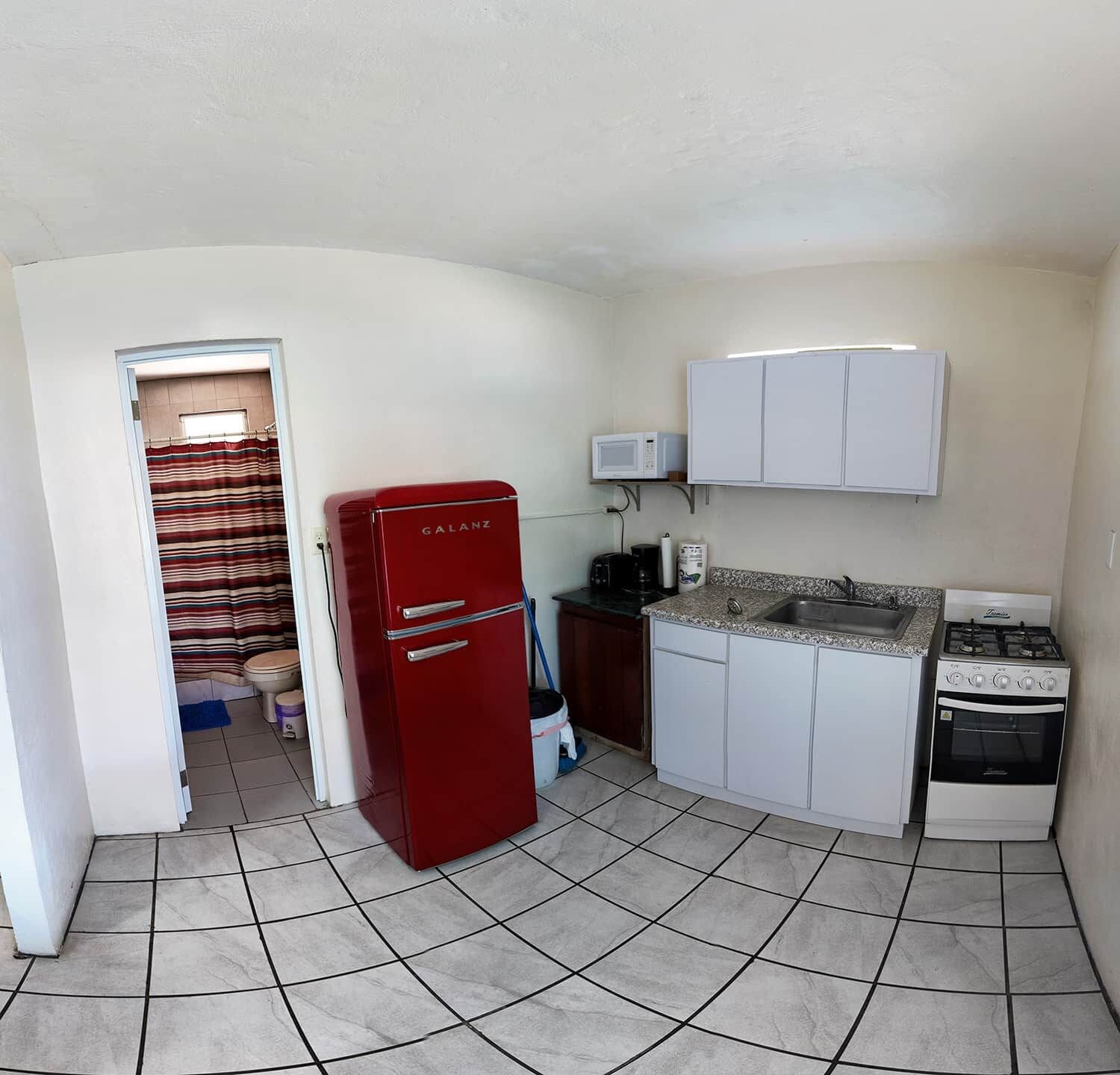 Full Kitchen with a microwave, coffee pot, toaster and cooking sets and eating sets