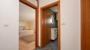 A bedroom with a bed, a bedside table, and a nightstand. - Stunning apartment in Vir with WiFi (Vir)