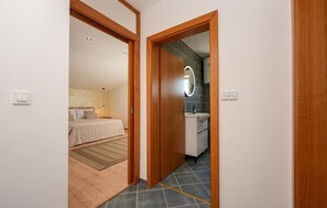 A bedroom with a bed, a bedside table, and a nightstand. - Stunning apartment in Vir with WiFi (Vir)