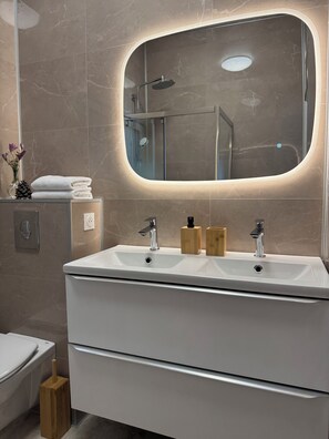 Shower, hair dryer, towels, soap