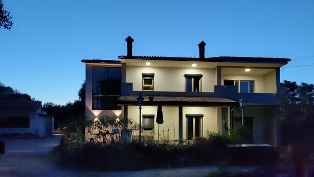 A two-story house with a balcony, a front door, and a small porch area. - 3 bedroom beautiful apartment in Barban (Barban)