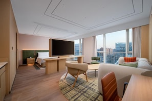 Chambre Premium, 1 très grand lit | Coin séjour