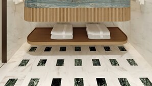 A modern bathroom with a marble sink, wooden vanity, and a large mirror. - Conrad Corfu (Corfu)