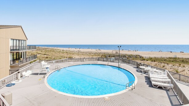 A pool with a view of the beach and ocean. - Walk to Ocean! Bethany Beach Retreat w/ Balcony (Bethany Beach)