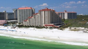 A beachfront hotel with multiple buildings, a sandy beach, and ocean views. - 2BR Gulf-front condo w/ private balconies (Miramar Beach)