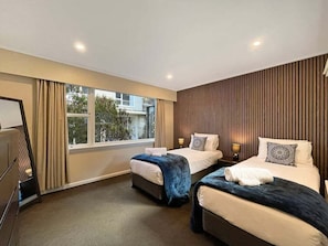 A hotel room with two beds, a large window, and a wooden panel wall. - The Biggest & Best Views, 3 Bedrooms, Walk To Town (Queenstown)