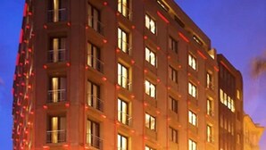 A multi-story hotel with a modern design, featuring balconies and a uniform facade. - Tunel Residence (Istanbul)