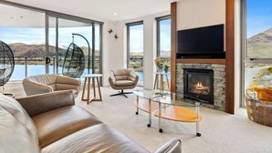 TV, fireplace, offices - Sunlit Serenity, Lakefront Apartment (Kawarau Falls)