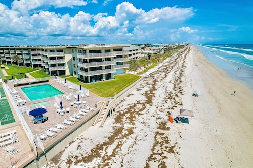 Oceanfront Condo with Pool & Patio – Peaceful Beachside Vibes