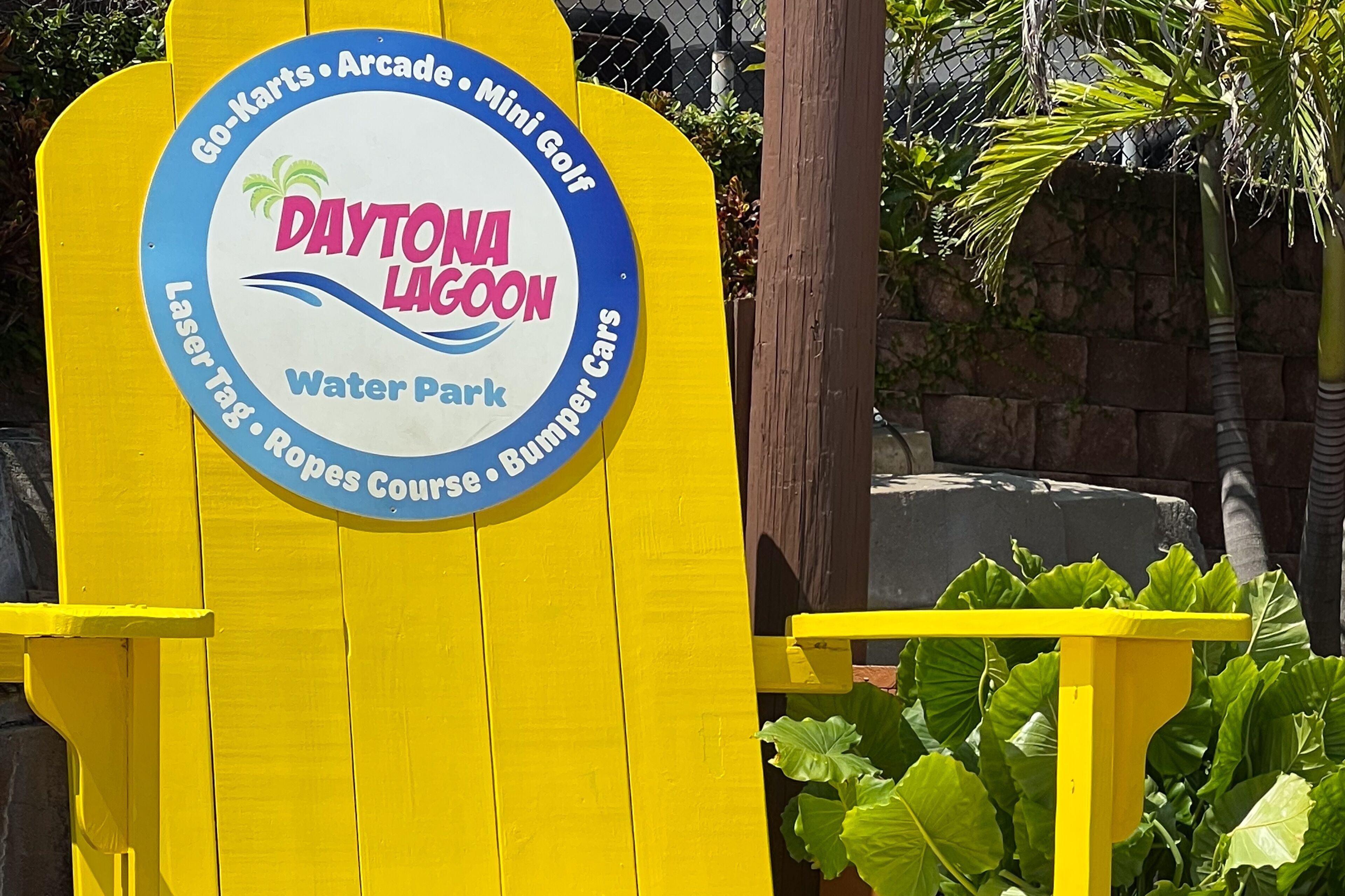 A sign for Daytona Lagoon Water Park listing amenities like Go-Karts, Arcade, Mini Golf, Laser Tag, Reeps Course, and Bumper Cars.