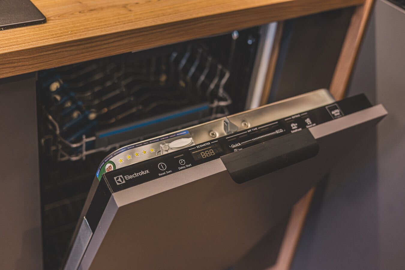 A dishwasher with a control panel featuring options like 'Reset 3sec' and 'Delay Start'.