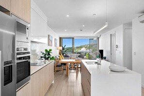 Fridge, microwave, oven, stovetop - Unit 506 'Drift' 63 Coolum Terrace (Coolum Beach)