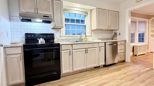 Private kitchen - 4-bedroom house in peaceful Cranston with AC for relaxing stays (Cranston)
