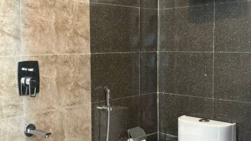 Shower, towels, soap, toilet paper