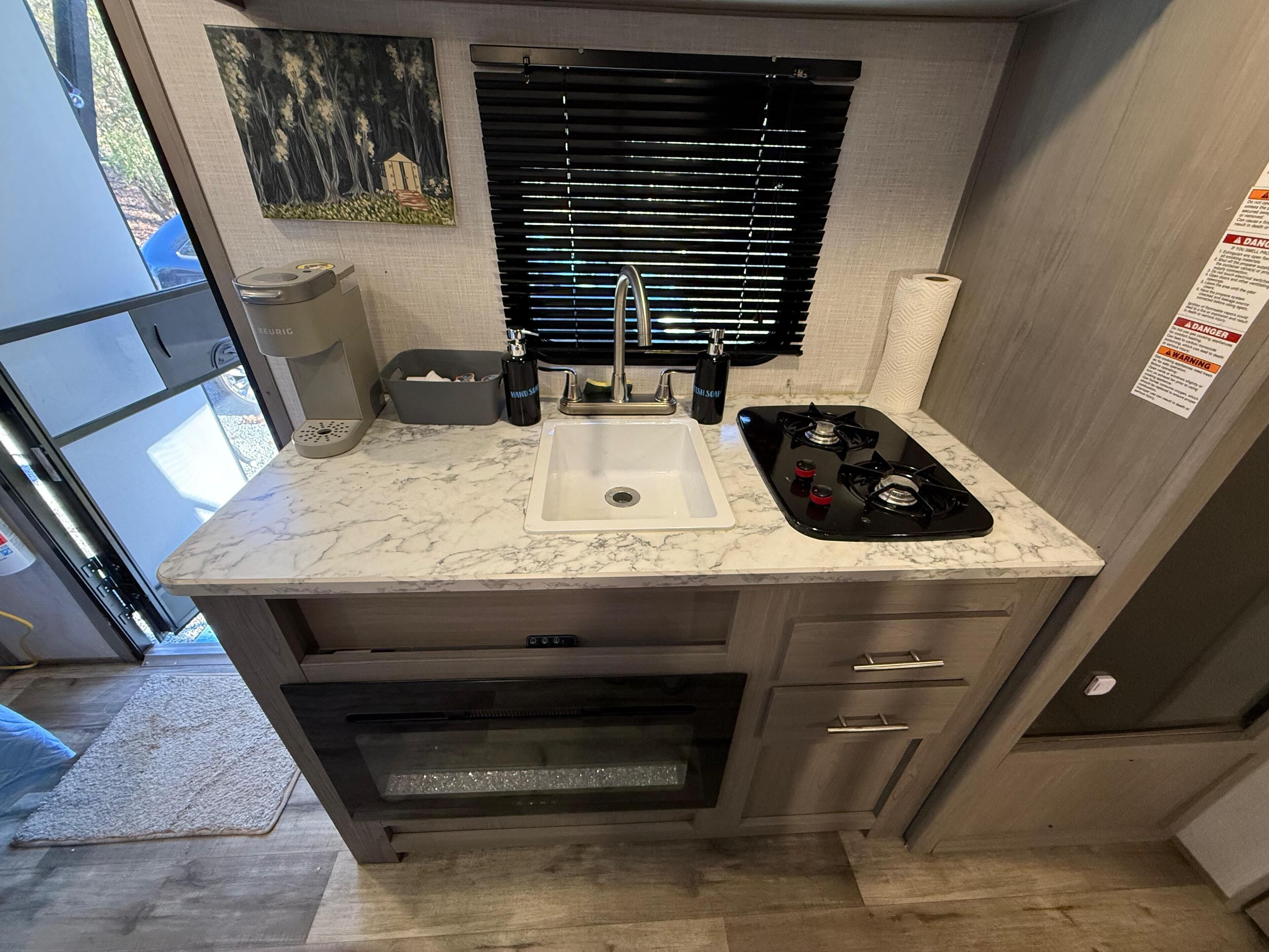 Fridge, microwave, stovetop, coffee/tea maker