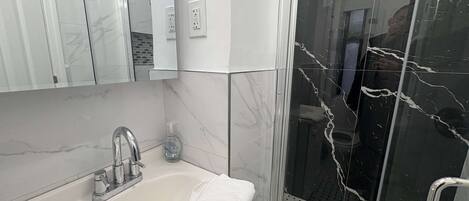 Shower, hair dryer, towels, soap