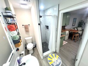 Shower, hair dryer, towels, toilet paper