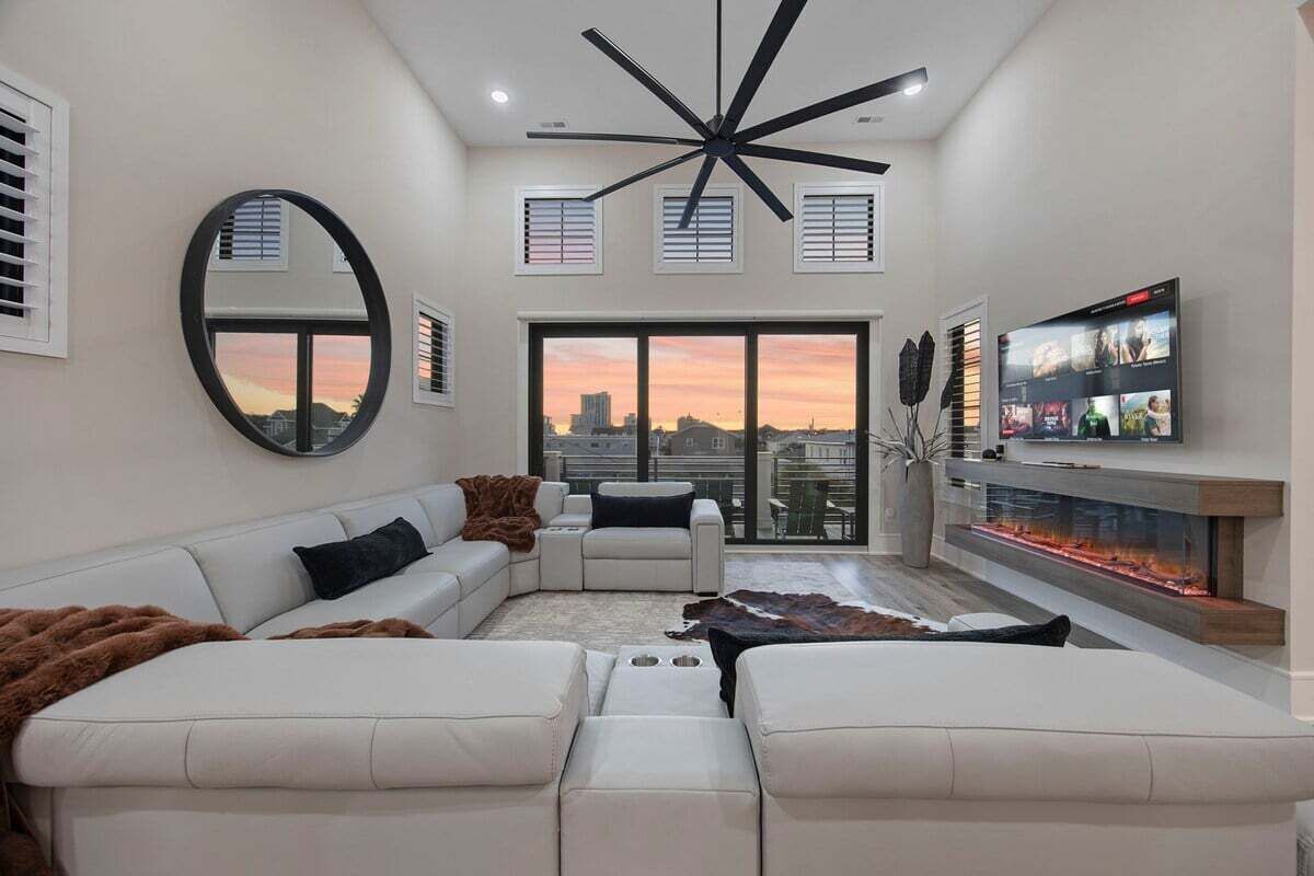 Smart TV, fireplace, books, computer monitors