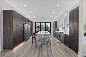 Fridge, microwave, oven, stovetop - The Chateau | Lux 5BR Home w/ Heated Pool + Spa (North Myrtle Beach)