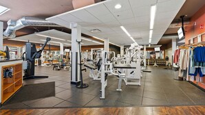 A gym with various exercise machines, a clothing rack, and a reception area. - Homestead Hideaway - Amenities, Mins from Skiing (Edwards)