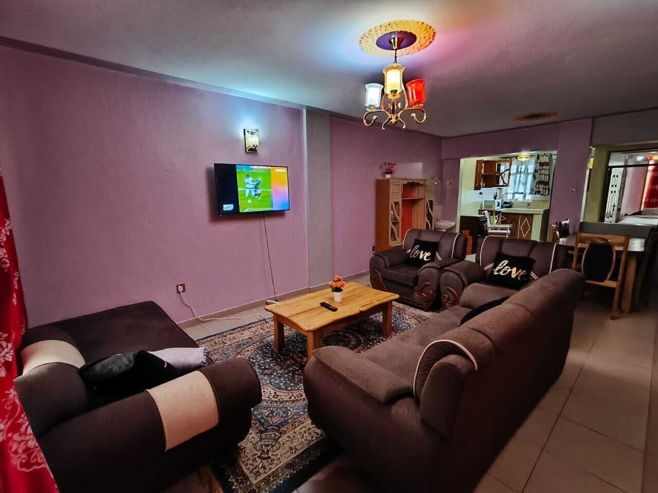 Family Apartment, City View | Living area | 32-inch Smart TV with digital channels