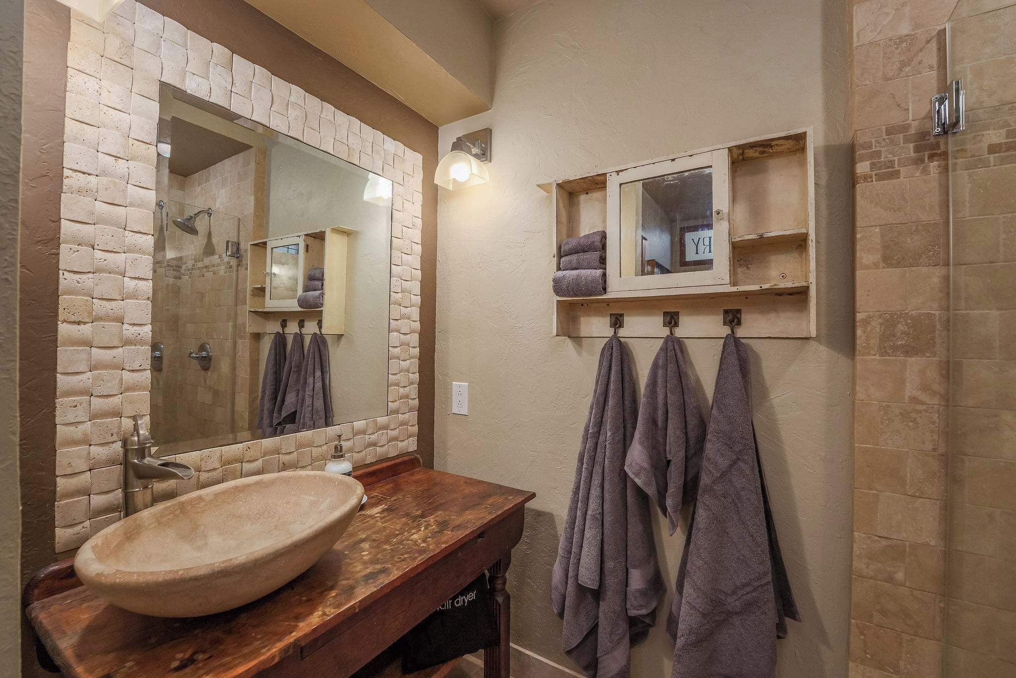 Shower, hair dryer, towels, shampoo