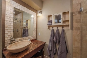 Shower, hair dryer, towels, shampoo