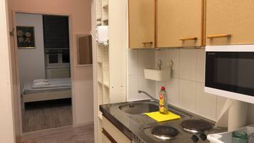 Basic-Apartment | Eigene Küche | Kühlschrank, Mikrowelle, Herdplatte, Geschirrspüler