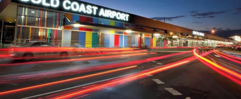 The exterior of Gold Coast Airport with a modern design and clear signage.