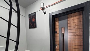 A staircase leading to a door with a wooden panel design. - VEFA HISTORICAL SUITES HOTEL (İstanbul)