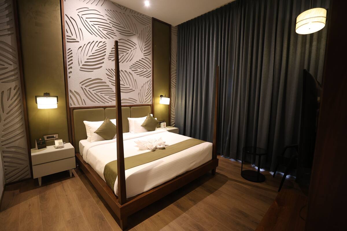 Luxury Suite, Garden View | In-room safe, blackout curtains, iron/ironing board, free WiFi