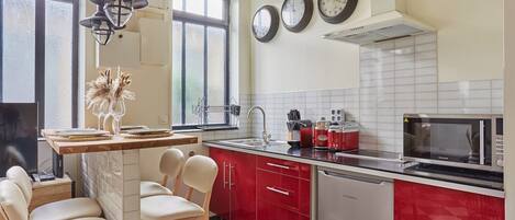 Fridge, microwave, stovetop, coffee/tea maker