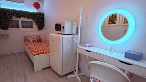 A bedroom with a bed, a desk, a chair, a mirror, and a microwave. - Strawberry_Charming studio with AC in vibrant Ewha Univ. neighborhood (Seodaemun-gu,)