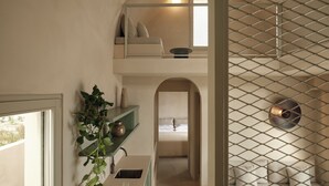 A modern kitchen with a built-in oven, a sink, and a countertop with a potted plant. - Geranium Villa with Private Pool, Epos Villas Imerovigli (Thira - Santorini)