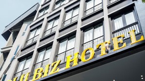 A hotel sign with the name "BLU BIZ HOTEL" in large yellow letters. - Blubiz Hotel 6 (Hanoi)