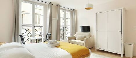 Desk, iron/ironing board, travel cot, bed sheets