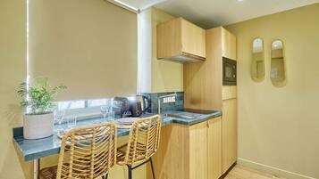 Fridge, microwave, stovetop, coffee/tea maker