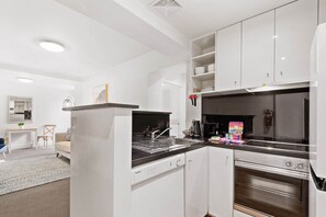 Fridge, microwave, oven, stovetop - Chic 1-Bed Apartment Steps From Shopping Street (South Yarra)