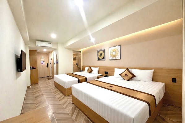 Chambre avec lits jumeaux | Minibar, fer et planche à repasser, Wi-Fi gratuit, draps fournis