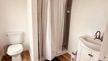 Shower, towels, soap, toilet paper